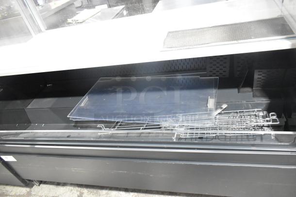 Structural Concepts SBZ6652DR metal merchandiser with top display case, 220V, 1 phase. Used condition, horizontal open design.
