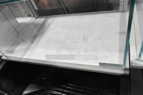 Structural Concepts metal commercial grab-n-go merchandiser with top display case, in good condition. Glass panels intact.