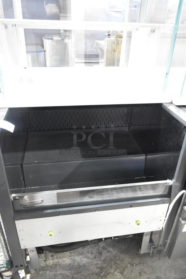 Structural Concepts SBZ2852DR horizontal merchandiser, metal, open front, top display case, 220V, in good condition.