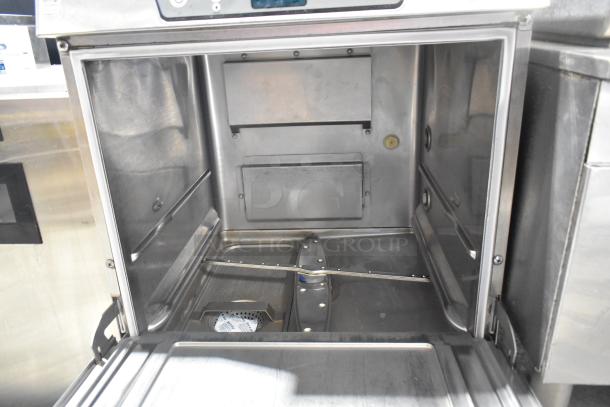 Hobart LXe Stainless Steel Commercial Undercounter Dishwasher, clean interior, open door, showing spray arms and filters.