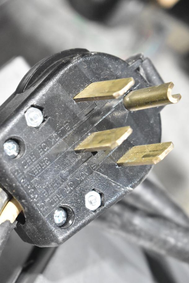 Close-up of a power plug for the Hobart LXe Stainless Steel Commercial Undercounter Dishwasher.