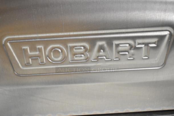 Hobart LXe stainless steel commercial undercounter dishwasher with embossed brand logo. 