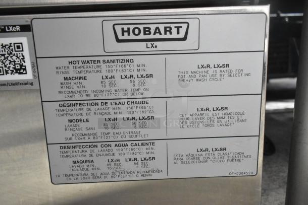 Hobart LXe stainless steel commercial undercounter dishwasher. Features hot water sanitizing details and model instructions visible.