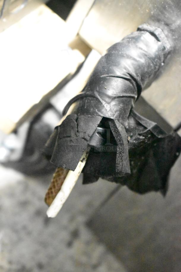 Close-up of a component from the 2020 Automatic Bar Controls JT-NITCOM-L Nitro Dispenser, featuring wrapped wiring.