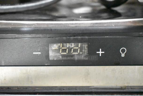 Stainless steel control panel with digital temperature display and adjustment buttons on the Automatic Bar Controls JT-NITCOM-L Nitro Dispenser.