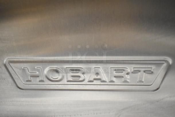 Hobart LXe stainless steel commercial undercounter dishwasher, embossed Hobart logo, industrial-grade durability.