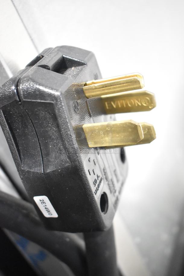 Close-up of the 2024 Hobart LXNR dishwasher's power plug, showing a three-prong configuration with "LEVITON" marking.