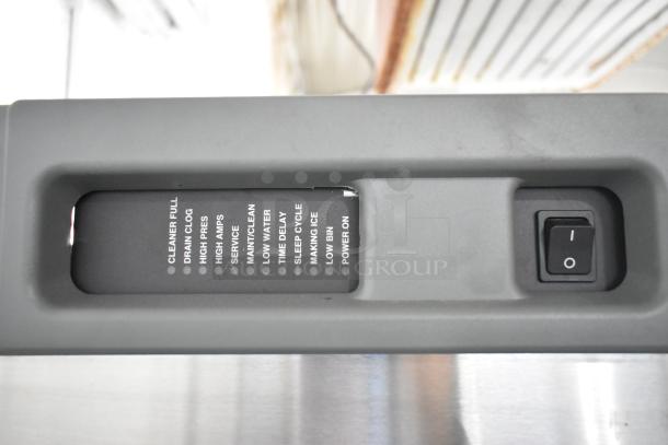 2024 Follett HMC1410WBT stainless steel commercial ice machine control panel. Labels indicate operational statuses.