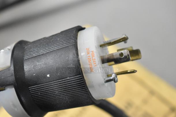 Close-up of a power plug for the Traulsen TBC13 blast chiller, showing 20A 125/250V specifications.