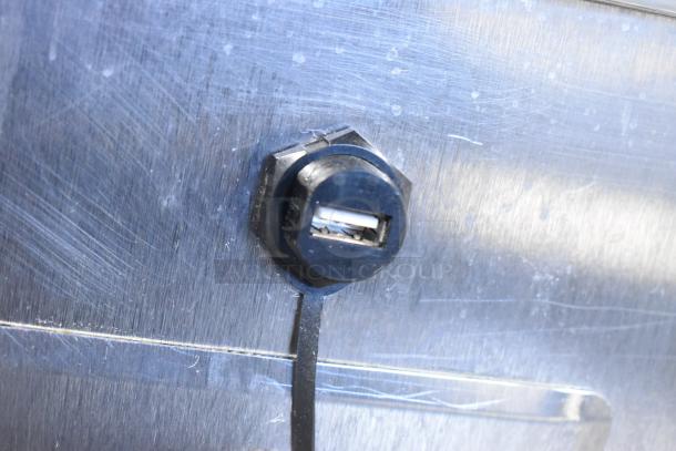 2019 Traulsen TBC13 stainless steel blast chiller close-up, showing a black plastic component on the exterior surface.