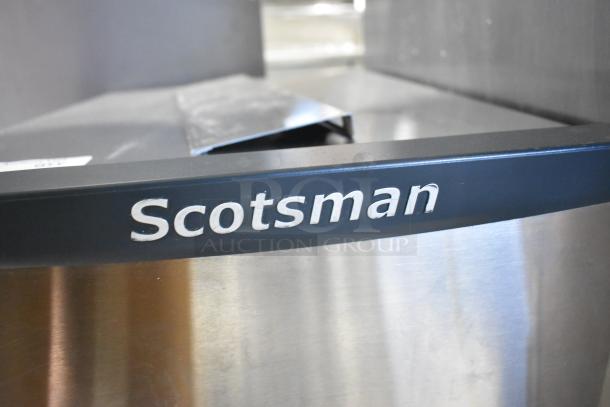 2018 Scotsman HID312A-1A stainless steel ice machine with "Scotsman" logo, 12 lb. bin, countertop model.