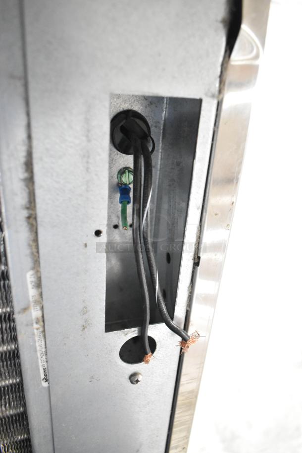 Scotsman C1030MA-32D ice machine wiring panel, showing exposed wires and connectors, indicating internal features.