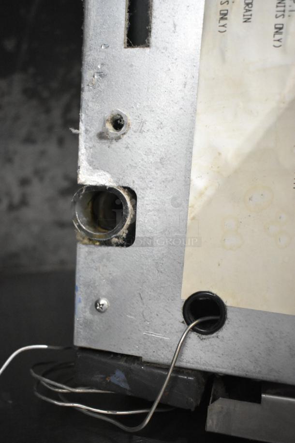 Scotsman CME806AS-32F commercial ice machine head, stainless steel, 208/230V, 1 phase. Visible wiring and surface wear.