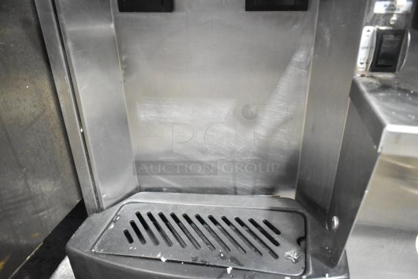 Stoelting SF121-38I2 stainless steel soft serve ice cream machine with mixer attachment; slight surface wear.