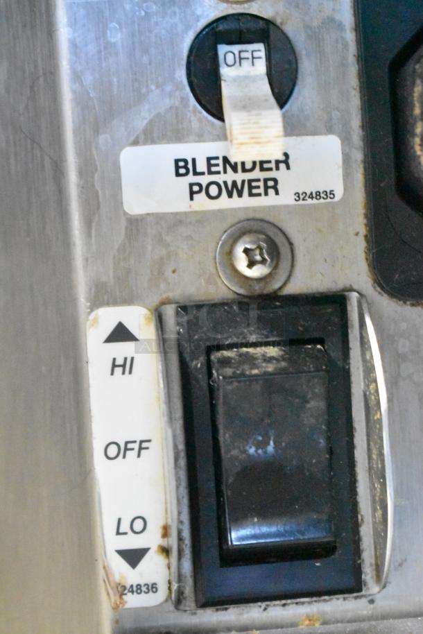 Close-up of Stoelting SF121-38I2 ice cream machine controls, showing "Blender Power" switch and settings label.