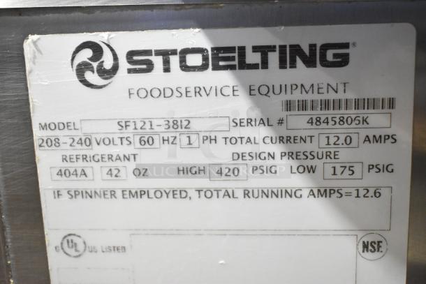 Stoelting SF121-38I2 stainless steel commercial soft serve ice cream machine label, with specs and model details.