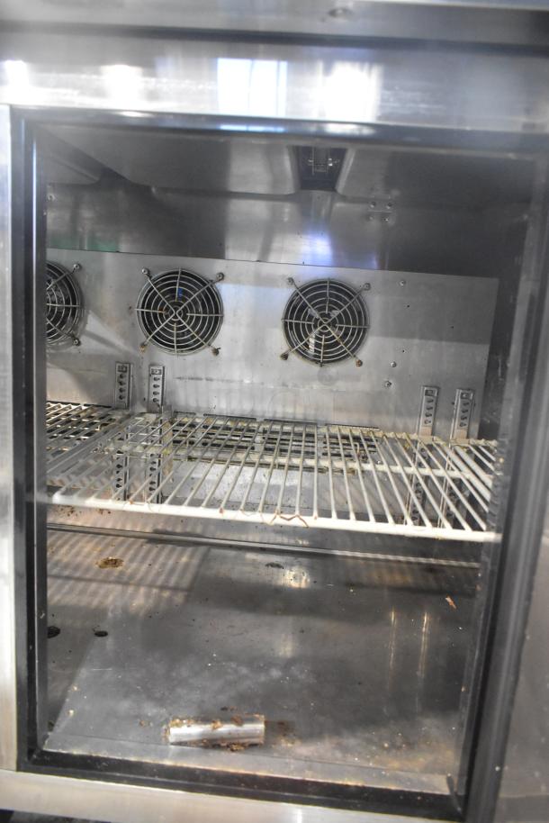 Turbo Air JBT-72 refrigerated buffet display table, stainless steel, on casters. Features shelves and cooling fans. 115V, 1 phase.