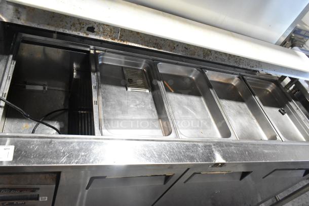 Turbo Air JBT-72 stainless steel refrigerated buffet display table with pans, showing moderate wear. 115V, 1 phase, on casters.