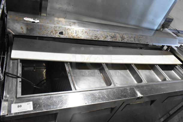 Turbo Air JBT-72 stainless steel refrigerated buffet table with commercial casters, 115V, 1 phase, showing signs of wear.