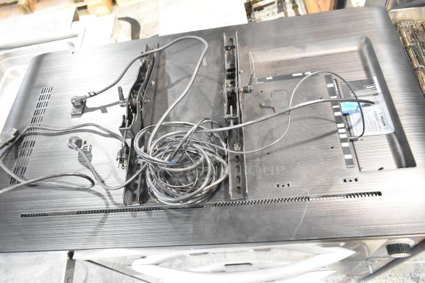 Two Samsung PH43F-P 43" TVs, back view with cords and mounts. Tags show 100-240V, 1 phase. Pickup only, no shipping.