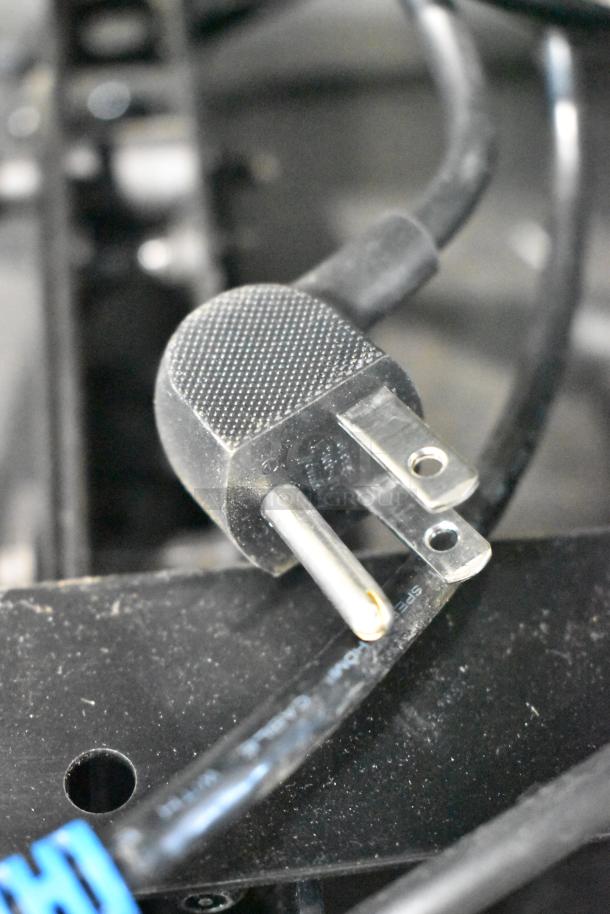 Close-up of a power plug, part of 2 Samsung PH43F-P 43" televisions, 100-240 volts, 1 phase, not eligible for shipping.