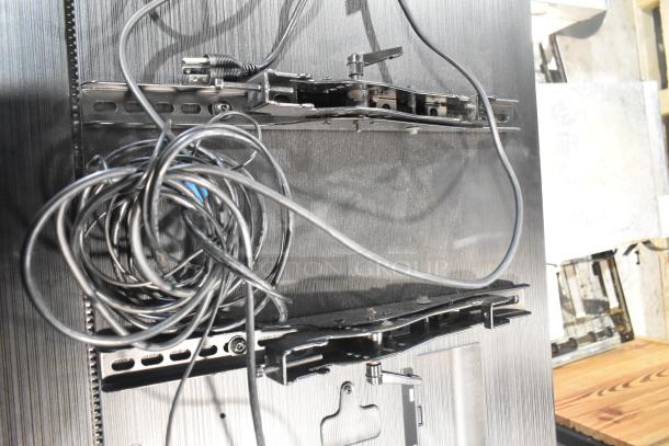 Two Samsung PH43F-P 43" TVs with mounting hardware and cables. Condition appears used. Buyer pick-up required.