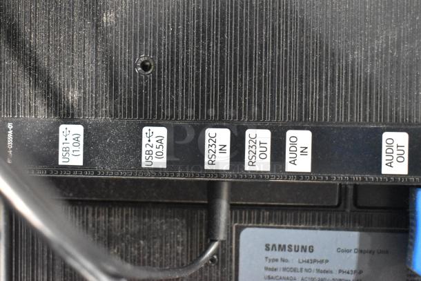 Samsung PH43F-P 43" TV ports and label, showing USB, RS232C, and audio connections. Model details and 100-240V info visible.