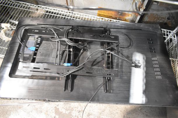 2 Samsung PH43F-P 43" TVs, wall-mounted with cables, 100-240V, 1 Phase. Pickup required, no shipping available.