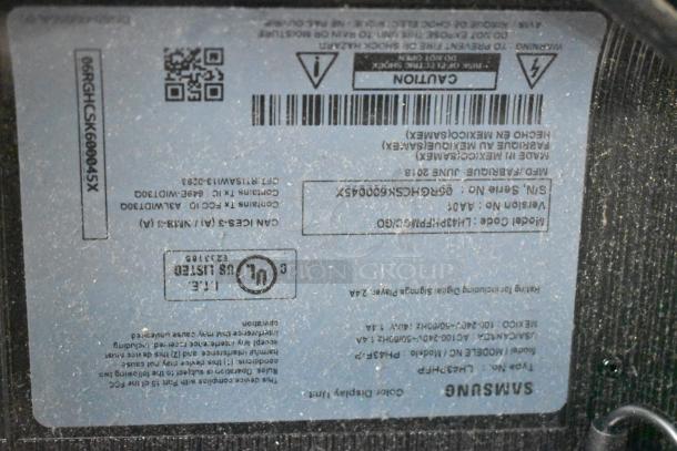 Close-up of Samsung PH43F-P TV label. Shows model, voltage (100-240V), phase, and certifications. Buyer pick-up required.