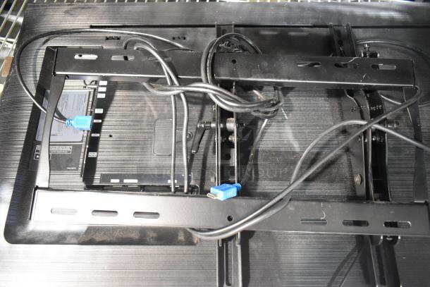 Two Samsung PH43F-P 43" TVs, 100-240 Volts, visible metal mount, cords attached; local pickup required.