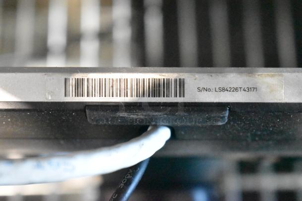 Barcode and serial number S/No: LS84226T43171 visible on a device edge, part of an auction lot including a Toast POS monitor and Epson printers.