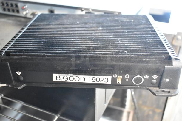 POS system with label "B.GOOD 19023" showing connectivity ports and power button. Ideal for retail or restaurant setups.