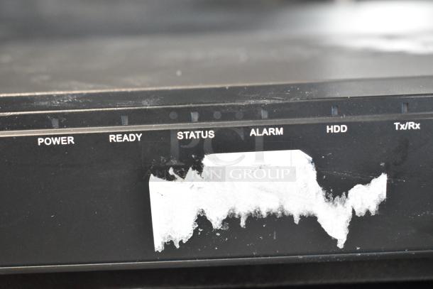 Control panel with labels: Power, Ready, Status, Alarm, HDD, Tx/Rx; tape remnants obscuring part of the panel.