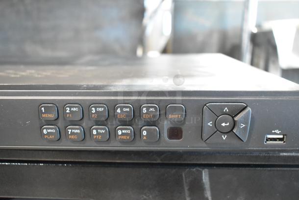 Close-up of a control panel with keypad and arrow buttons; part of an auction lot including Toast POS monitor and other devices.