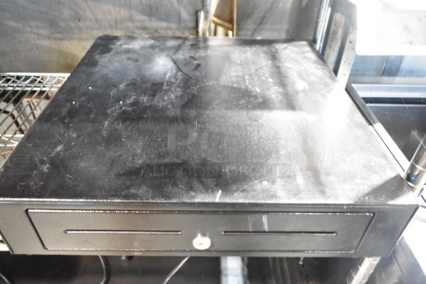 Black metal cash drawer, slightly scuffed, with a key lock, part of a 9-item auction bundle including POS equipment.