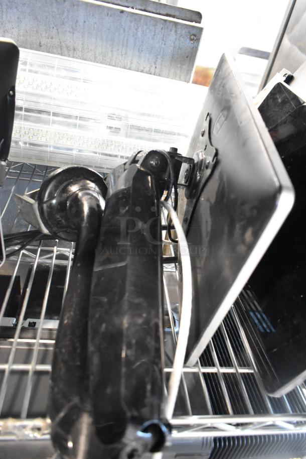 Eight POS monitors including Toast and Elo POS monitors, Samsung S22D300HY monitor on metal shelving, used condition.