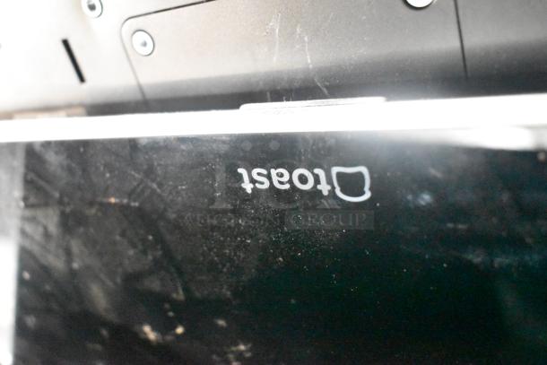 Eight items including various Toast POS monitors, Elo POS monitor, and a Samsung S22D300HY computer monitor. Signs of wear visible.