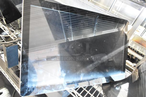 8 assorted monitors including Toast POS, Elo POS, and Samsung S22D300HY, mixed condition, visible cords and stands.