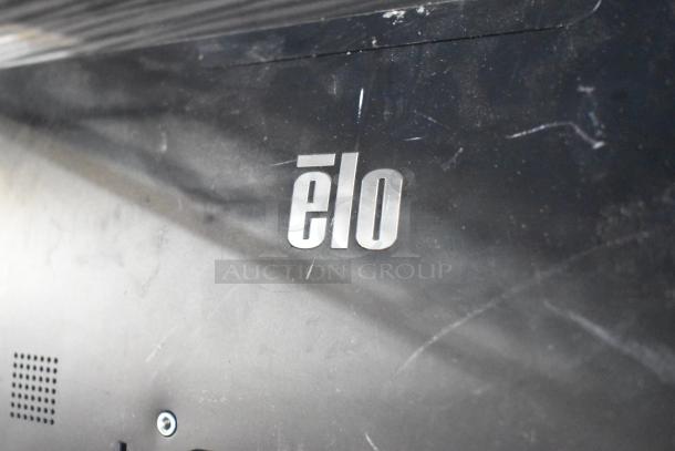 Elo POS monitor with visible branding, part of an auction with 8 various items including Toast POS and Samsung S22D300HY monitors.