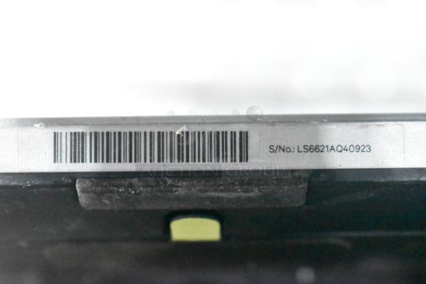 Barcode and serial number LS6621AQ40923 label on electronic equipment, possibly a monitor.