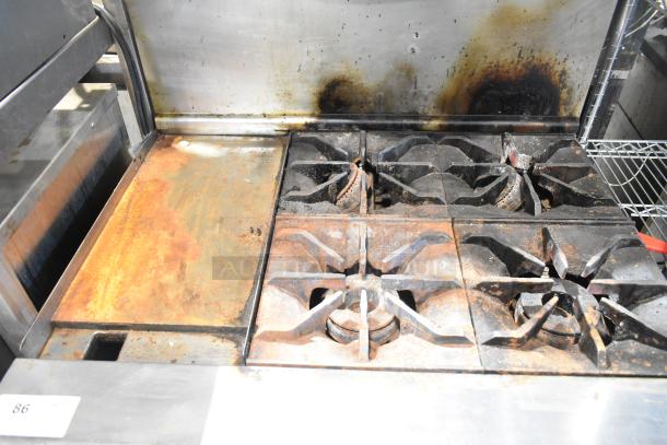 Imperial IR4-612 stainless steel gas griddle with 4-burner range, oven, over-shelf, and backsplash, shows wear and rust.