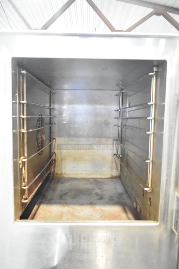 Intek Xtreme Steam XSG-5 stainless steel steam cabinet interior, natural gas, single deck, on equipment stand, 65,000 BTU.