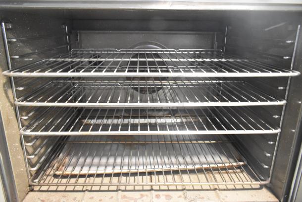 Blodgett stainless steel gas convection oven, full-size, features metal racks, solid doors, and thermostatic controls.