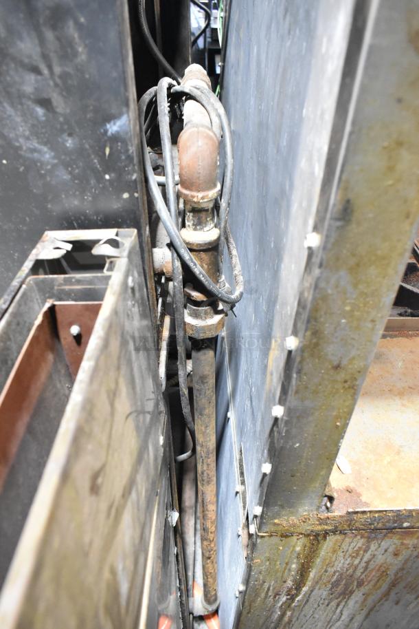 Blodgett commercial gas convection oven interior showing metal racks and thermostatic controls. Rust visible on components.