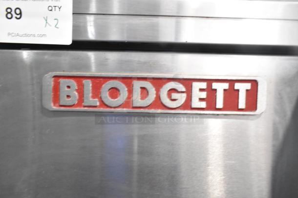 Blodgett stainless steel commercial gas convection oven with solid doors, metal racks, and thermostatic controls. Quantity 2.