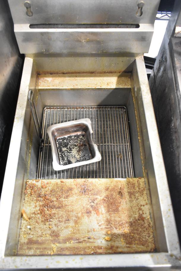 Pitco Frialator 14S stainless steel deep fat fryer, natural gas powered, used condition with visible oil and residue.