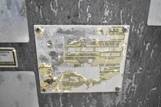 Pitco Frialator 14S deep fat fryer manufacturer's plate, heavily worn and partially illegible, indicating natural gas use.