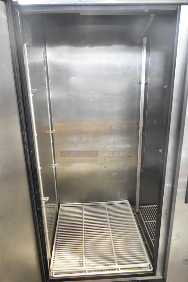 True TS-49 stainless steel commercial 2-door cooler with poly-coated racks, 115V, 1 phase, interior view showing rack.