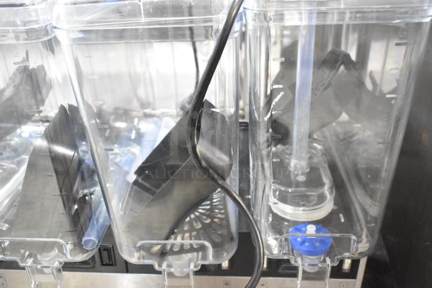 Brand new Vollrath VBBE4-37-F stainless steel quadruple 5.28-gallon beverage dispenser, 115V, 1 phase, with fountain spray.