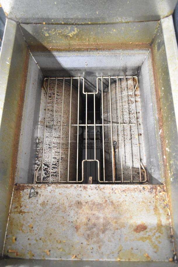 Frymaster GF40SD stainless steel natural gas fryer, 122,000 BTU, visible wear and grease stains, commercial use.